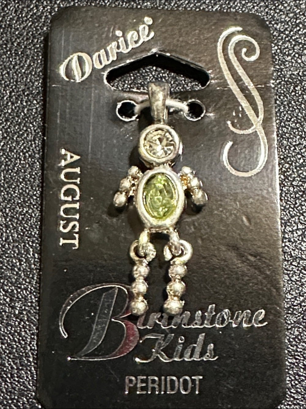 39.  Darice Birthstone Kids August Peridot Stick Boy Charm